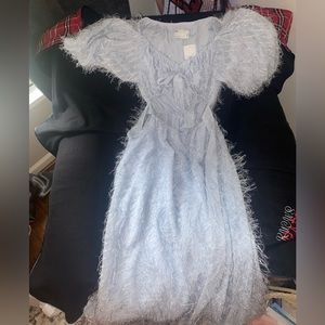 Feathery blue maxi dress with long puffy sleeves and ties in the front